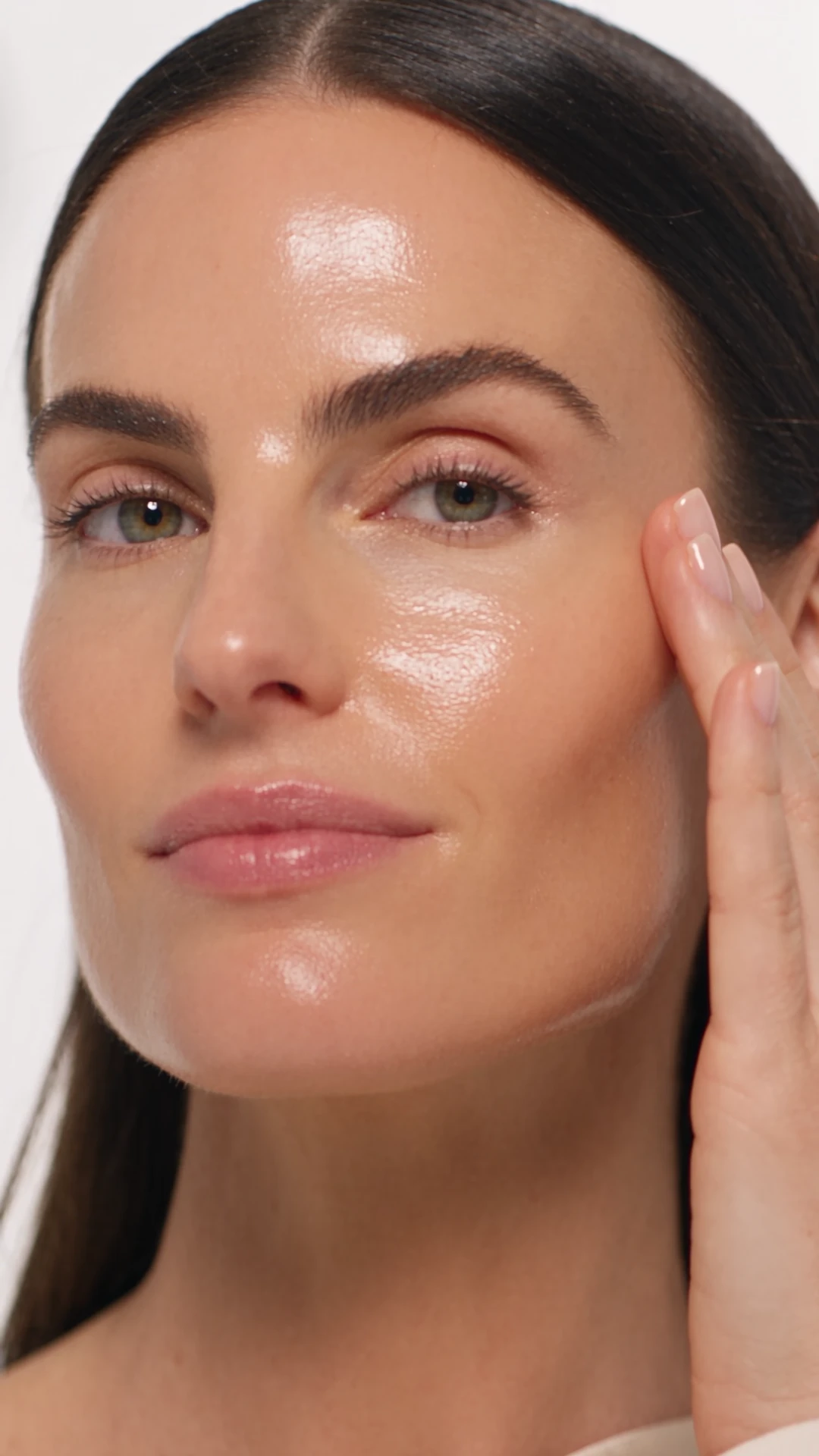Close-up of dewy, glowing skin after the ÉLANÉ Hydra Veil Serum